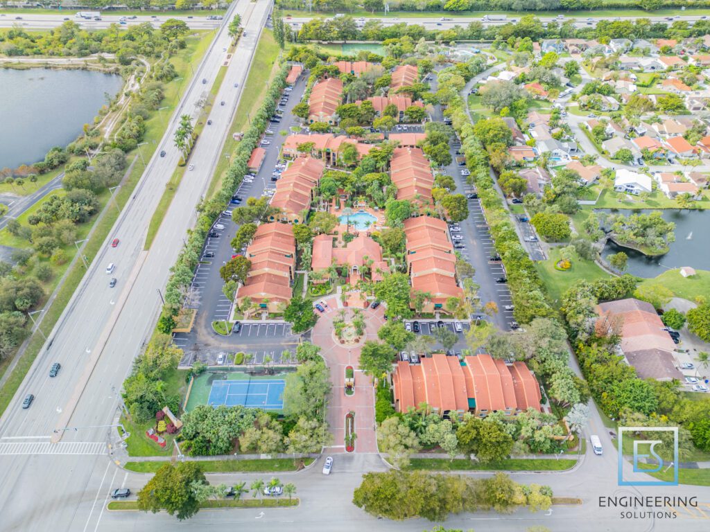 A bird 's eye view of an orange roofed housing complex.