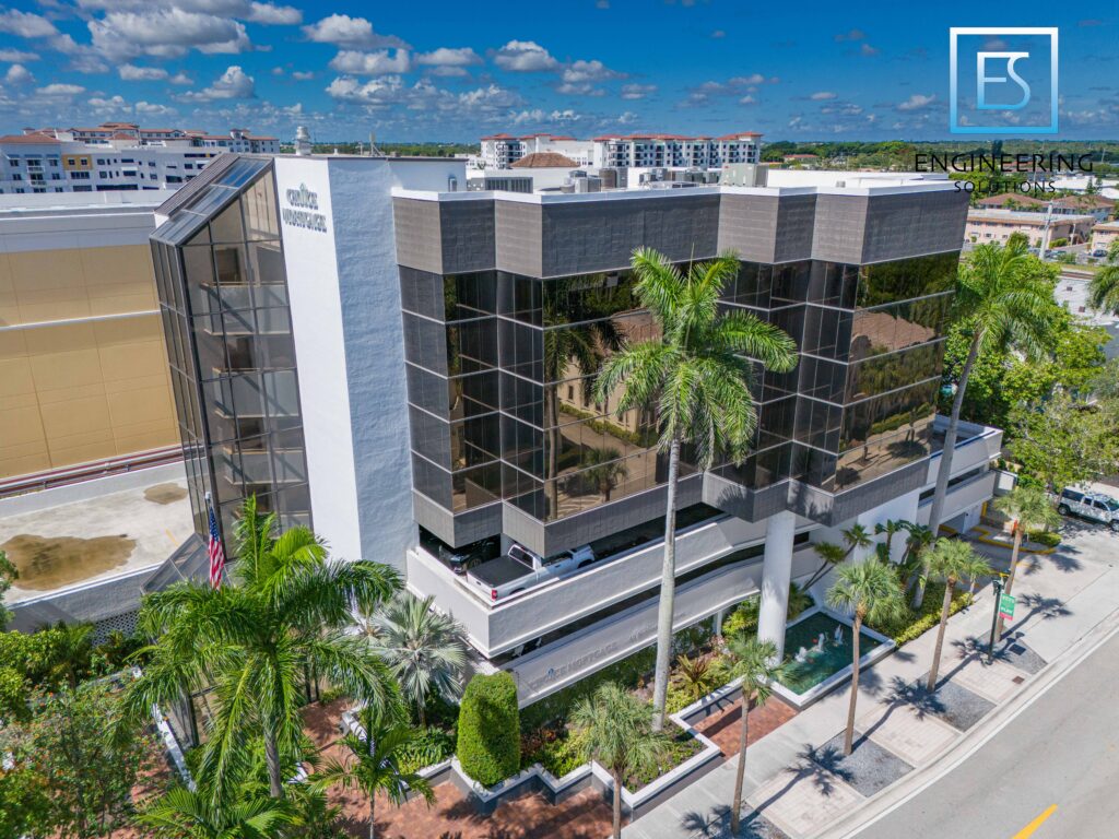 A building with palm trees in front of it