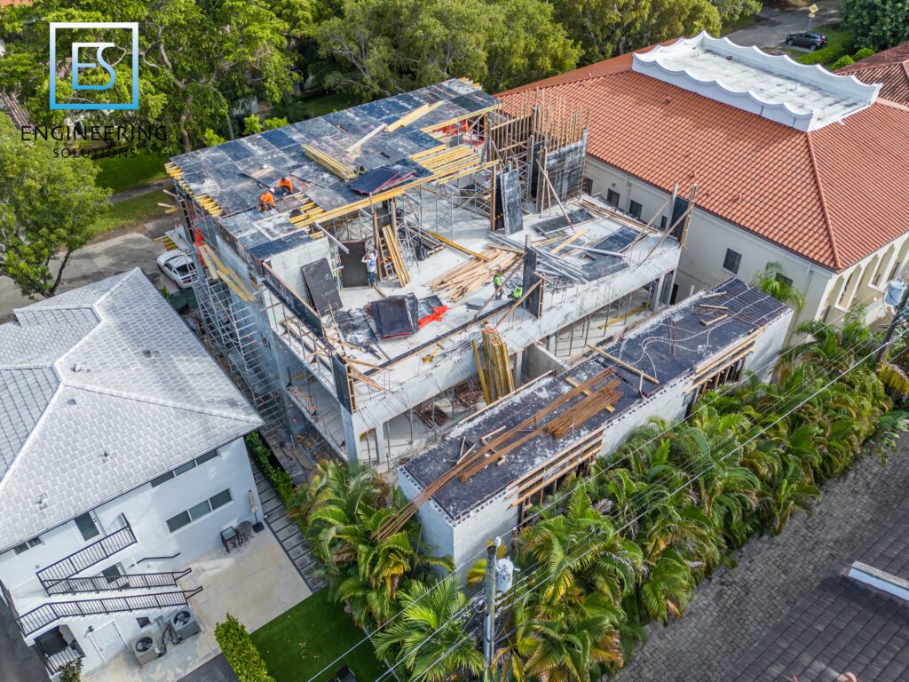 A building that is being built with many windows.